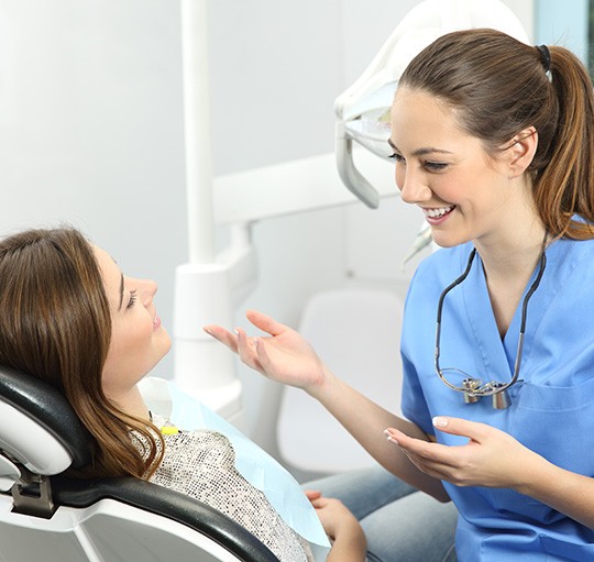 Dentist talking to a patient